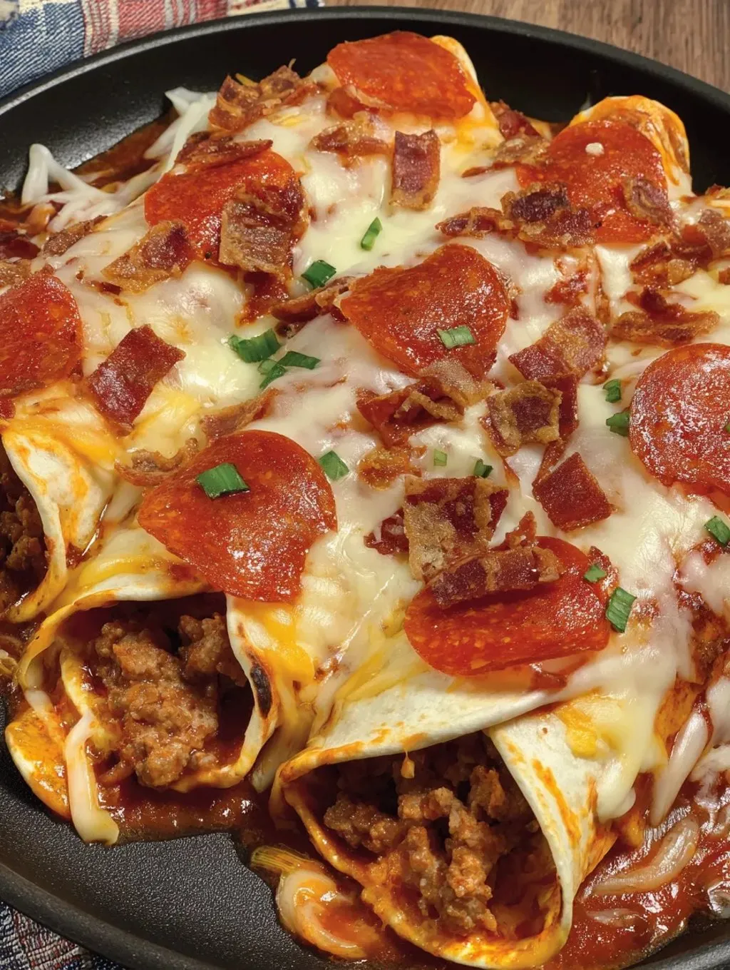 A delicious meal of pizza enchiladas with ground beef.